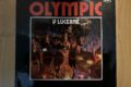 Přední strana obalu desky Olympic v Lecerně. Jde (téměř) o jediné skutečné živé album legendární kapely.